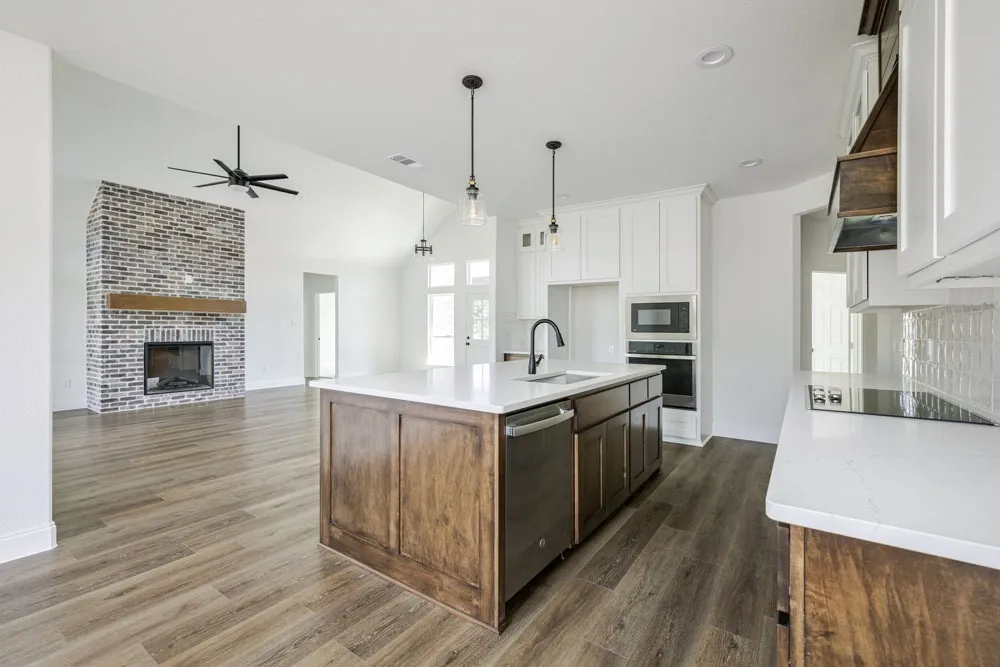 A Bravos open-plan kitchen with a wood island and bright living space
